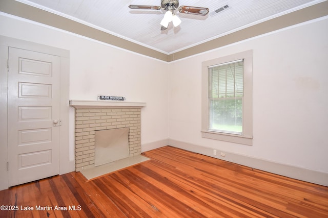 1330 Pearson Chapel Rd, Alexander City, AL 35010 - unfurnished living room featuring a fireplace, ornamental molding, wood finished floors, and ceiling fan