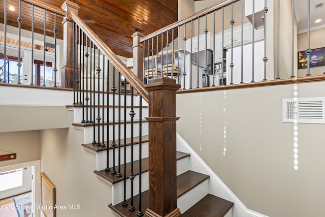 stairway featuring wood ceiling