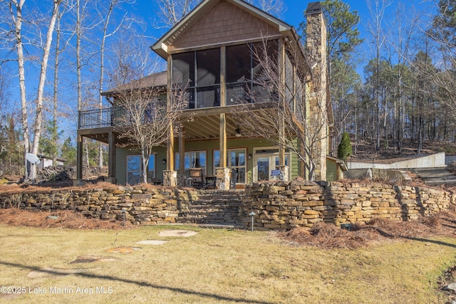 rear view of house with a sunroom