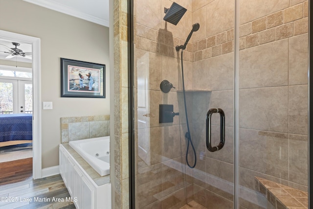 bathroom with ceiling fan, wood-type flooring, ornamental molding, and plus walk in shower