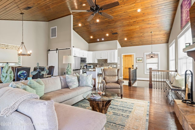 living room featuring ceiling fan, wooden ceiling, a barn door, high vaulted ceiling, and wood-type flooring