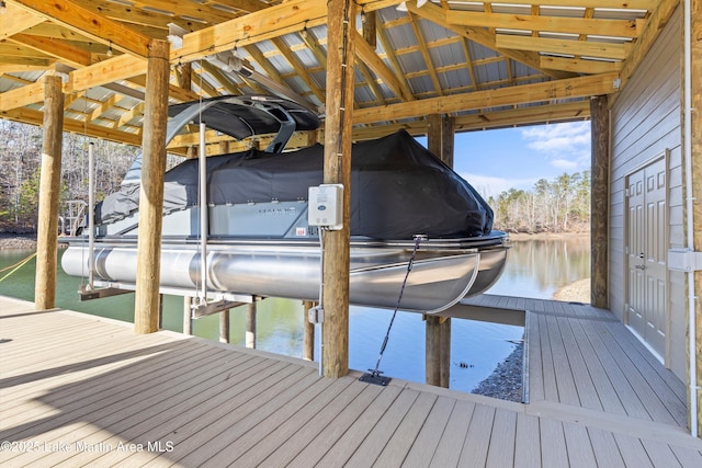 view of dock with a water view and boat lift