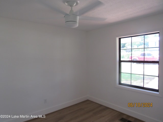 unfurnished room featuring hardwood / wood-style flooring