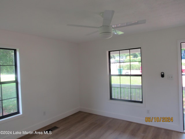 empty room featuring hardwood / wood-style floors and ceiling fan