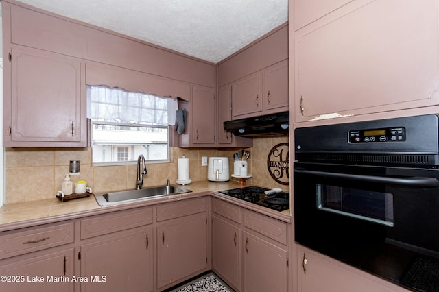 kitchen with tasteful backsplash, sink, white cabinetry, and black appliances