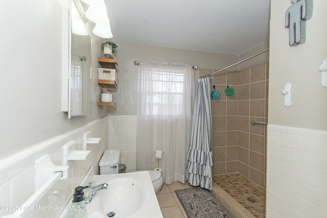 bathroom featuring sink, tile walls, walk in shower, toilet, and tile patterned floors