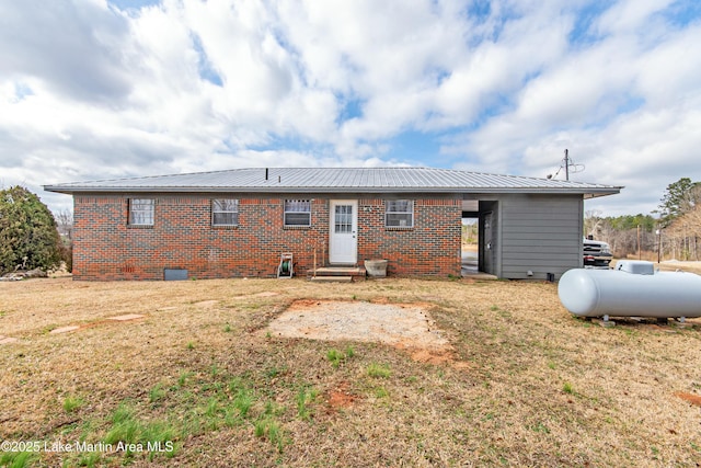 rear view of house with a lawn