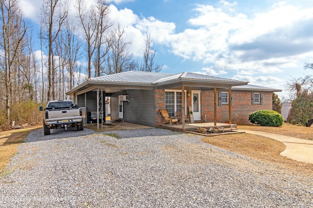 view of front facade with a carport and covered porch