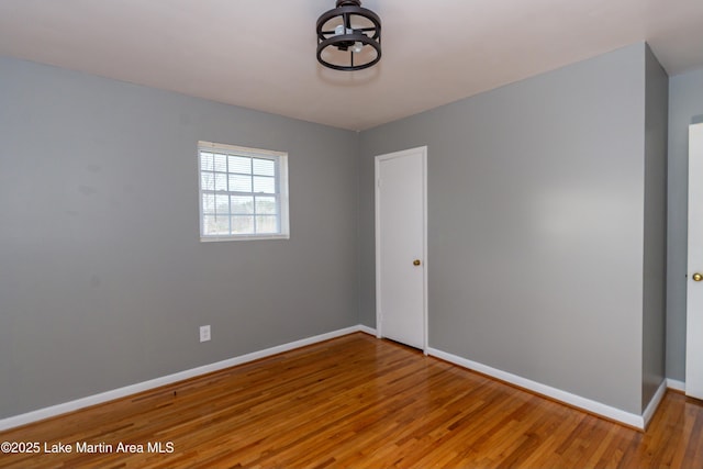 unfurnished room featuring wood-type flooring