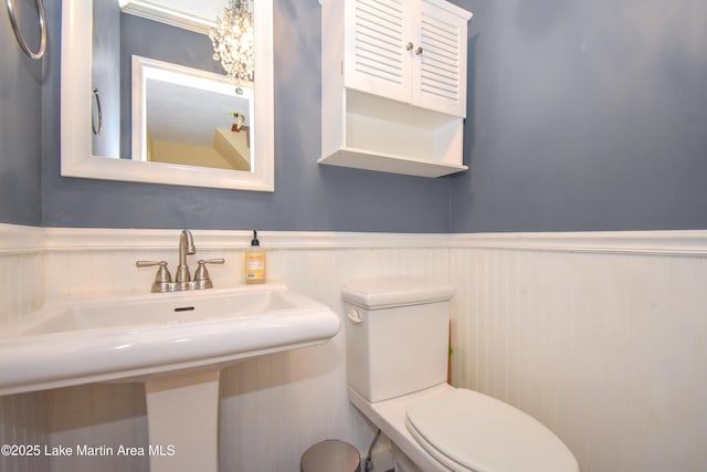 bathroom featuring sink and toilet