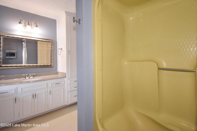 bathroom featuring vanity and walk in shower