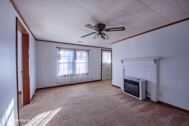 unfurnished living room with heating unit, light carpet, ornamental molding, ceiling fan, and a fireplace