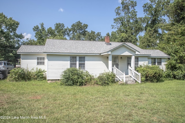 ranch-style house with a front lawn