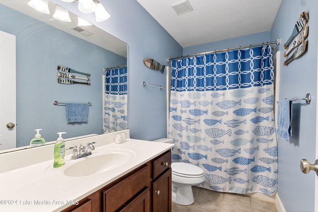 bathroom with tile patterned flooring, a textured ceiling, toilet, vanity, and a shower with shower curtain