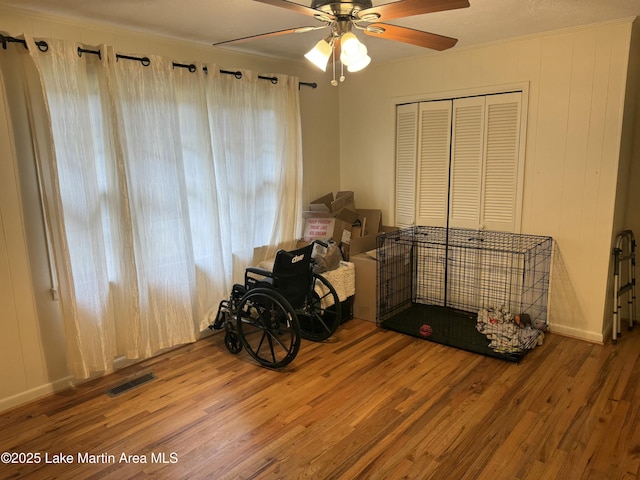 miscellaneous room featuring ceiling fan, hardwood / wood-style floors, and crown molding