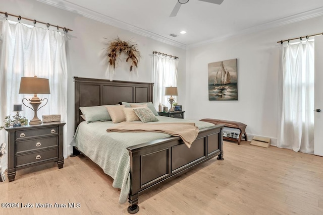 bedroom with light hardwood / wood-style flooring, ceiling fan, and crown molding