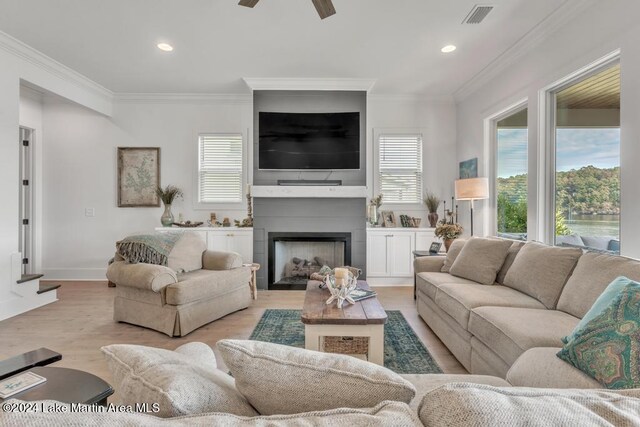 218 Williams Rd, Alexander City, AL 35010 - living room with light wood finished floors, ornamental molding, a ceiling fan, recessed lighting, and a fireplace