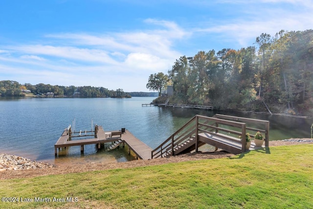 dock area with a water view and a lawn