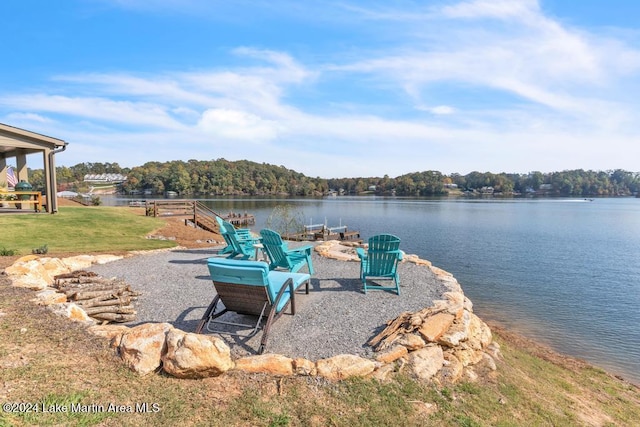 exterior space featuring a water view and a yard