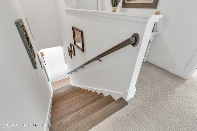 stairs featuring hardwood / wood-style flooring