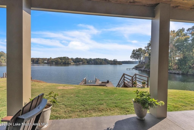 exterior space featuring a yard and a water view