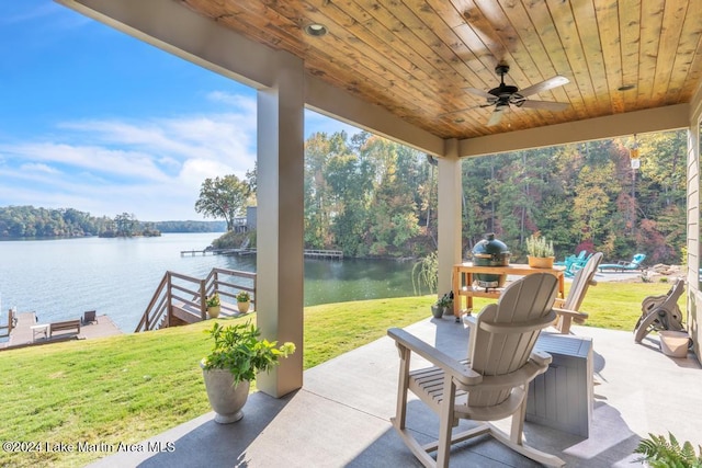 view of patio / terrace with a water view and ceiling fan