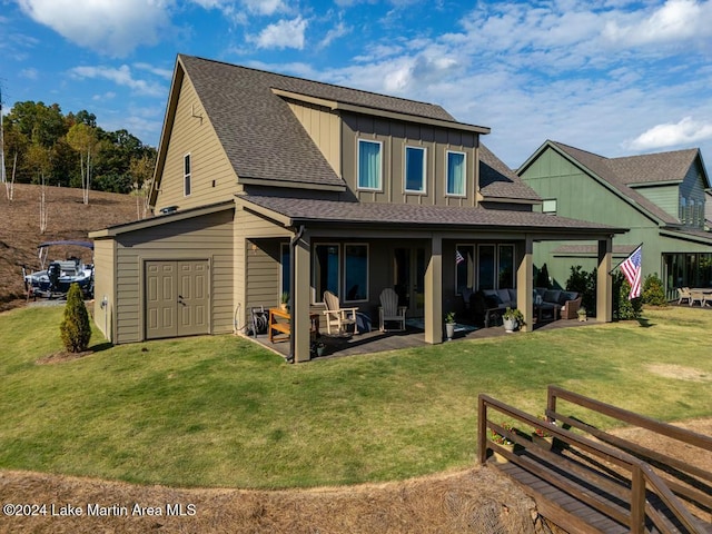 rear view of property with a lawn, a patio area, and an outdoor hangout area