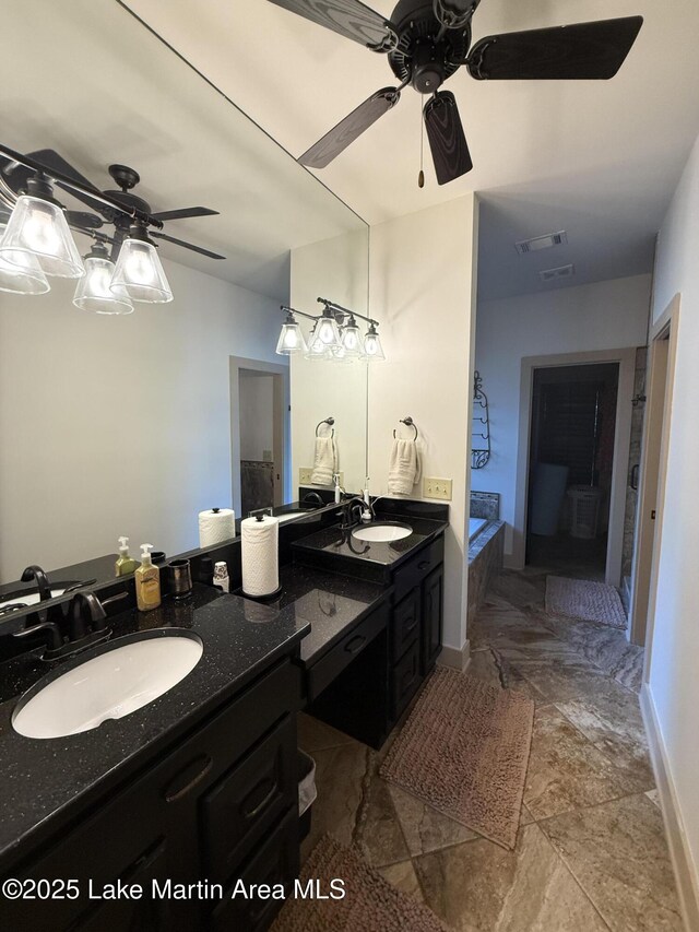 43 Shady Cv, Dadeville, AL 36853 - bathroom featuring ceiling fan, double vanity, and a bathtub