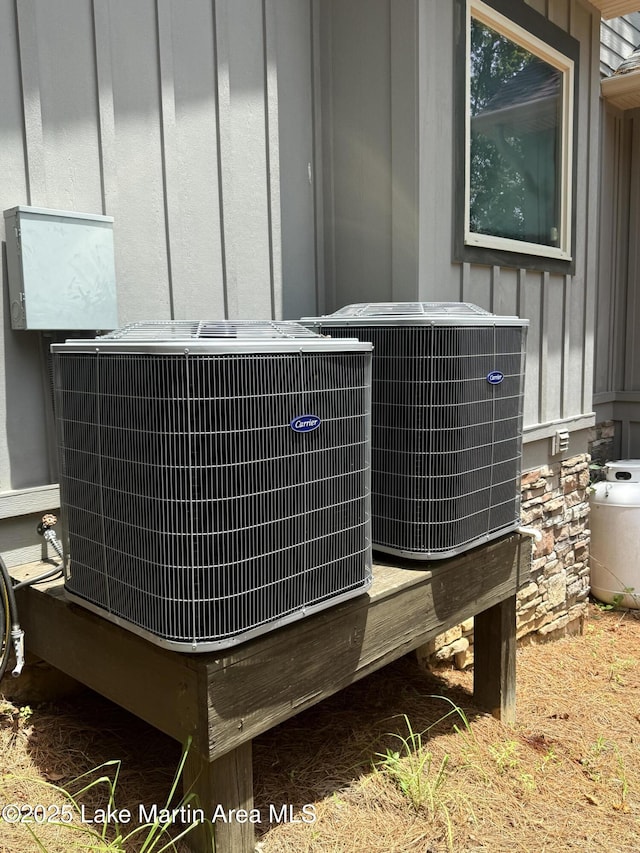 43 Shady Cv, Dadeville, AL 36853 - exterior view of a central AC unit and board and batten siding