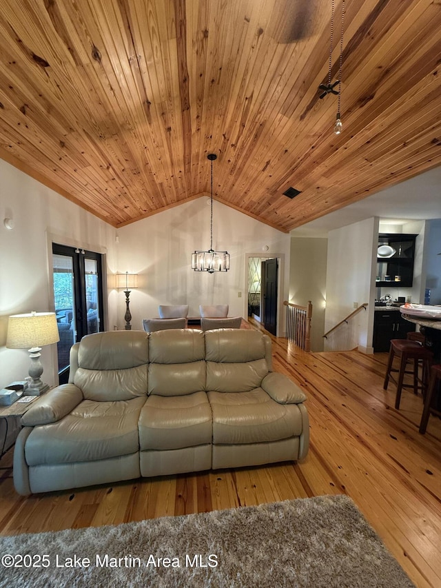 43 Shady Cv, Dadeville, AL 36853 - living area featuring lofted ceiling, hardwood / wood-style flooring, wood ceiling, and a chandelier