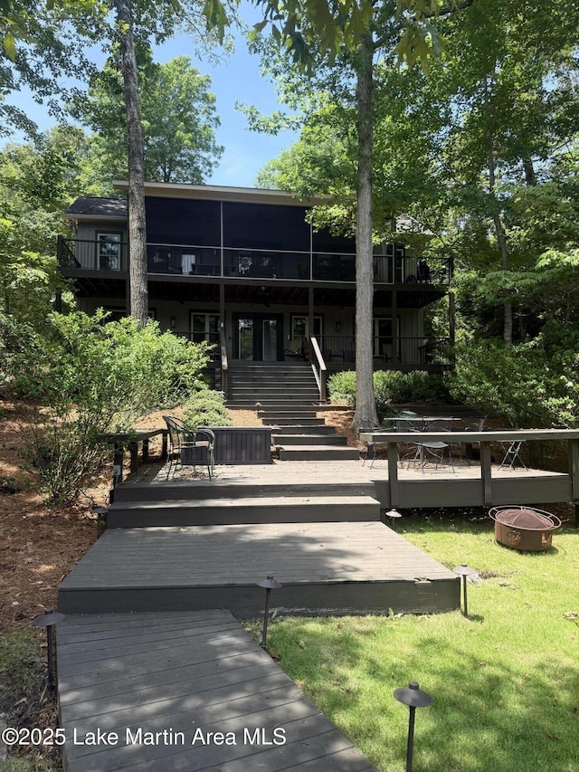 43 Shady Cv, Dadeville, AL 36853 - back of house featuring an outdoor fire pit, a deck, a lawn, a balcony, and stairway