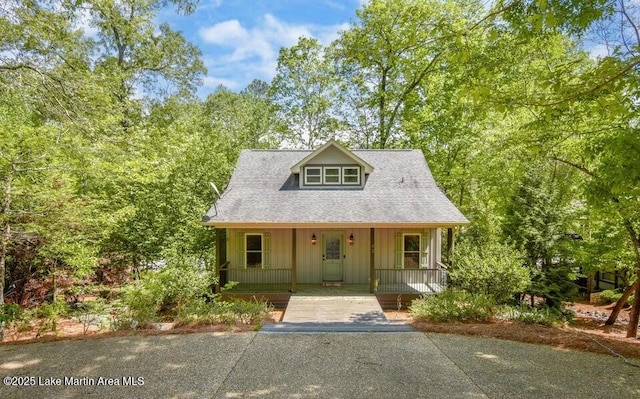 43 Shady Cv, Dadeville, AL 36853 - view of front facade with covered porch and board and batten siding