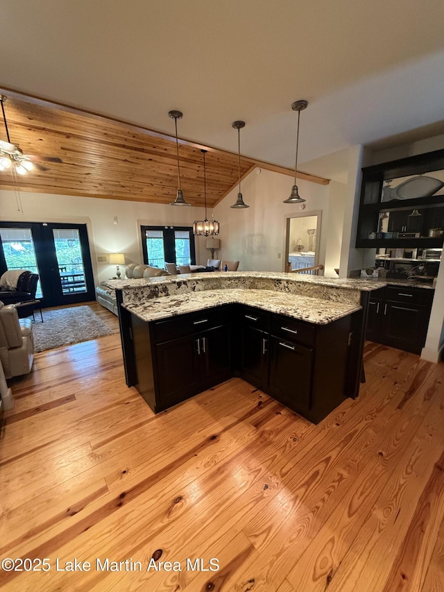 43 Shady Cv, Dadeville, AL 36853 - kitchen with open floor plan, light wood finished floors, light stone counters, pendant lighting, and wood ceiling