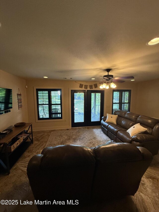 43 Shady Cv, Dadeville, AL 36853 - carpeted living room featuring healthy amount of natural light, a ceiling fan, and recessed lighting