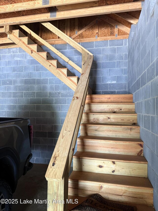 43 Shady Cv, Dadeville, AL 36853 - staircase featuring concrete block wall and a wood stove