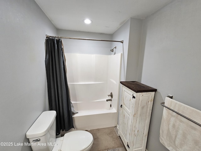 bathroom with toilet and shower / bathtub combination with curtain