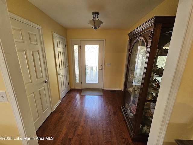 foyer with dark hardwood / wood-style floors