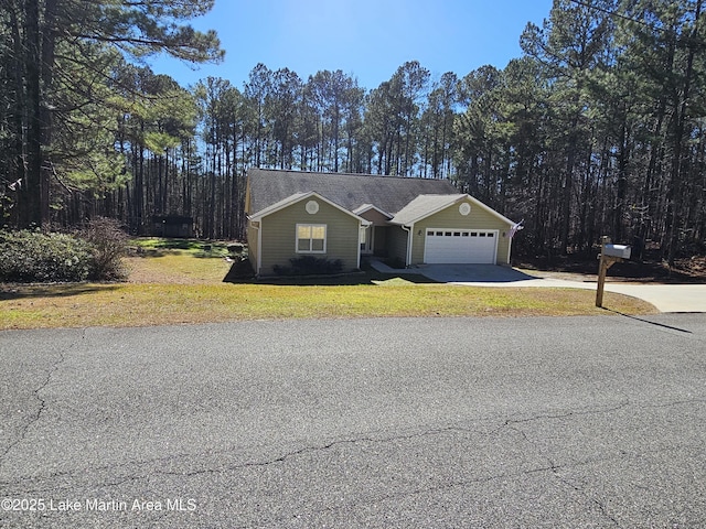 view of front facade featuring a front lawn and a garage