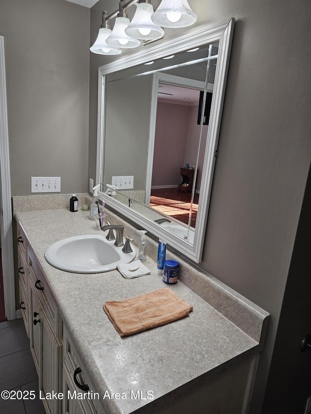 bathroom with tile patterned floors and vanity