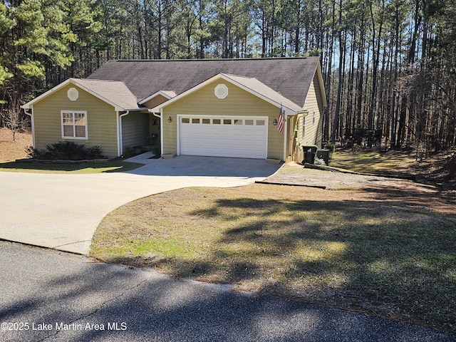 view of front facade with a front lawn and a garage