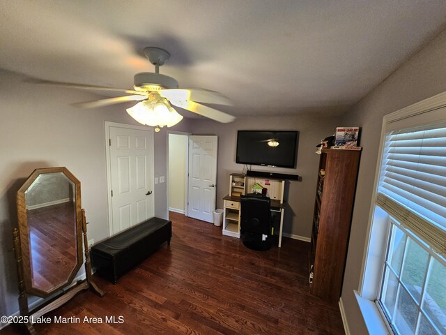 dining room featuring ceiling fan, dark hardwood / wood-style flooring, and crown molding