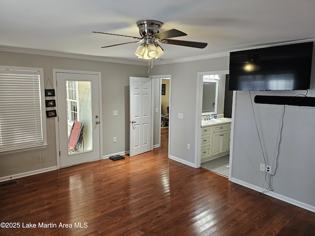 unfurnished bedroom with ceiling fan, hardwood / wood-style flooring, connected bathroom, and ornamental molding