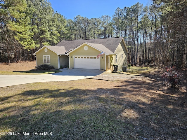 view of front of house with a front lawn and a garage