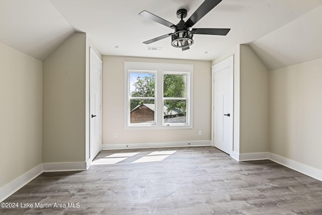 bonus room with ceiling fan, light hardwood / wood-style floors, and lofted ceiling