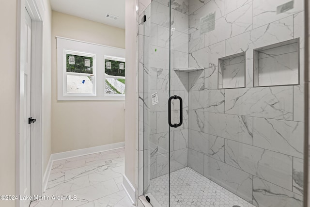 bathroom featuring an enclosed shower