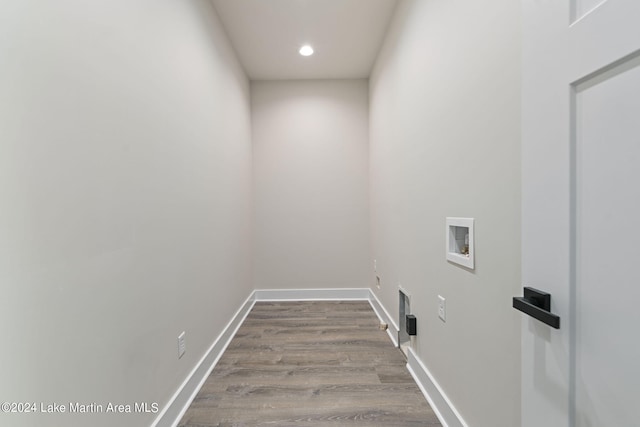 laundry area featuring washer hookup and light hardwood / wood-style floors