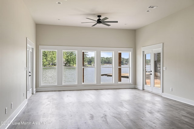 empty room with wood-type flooring and ceiling fan