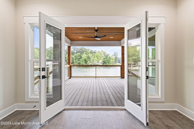 doorway to outside featuring hardwood / wood-style flooring, ceiling fan, and french doors