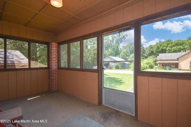 405 4th St, Tallassee, AL 36078 - unfurnished sunroom featuring wood walls
