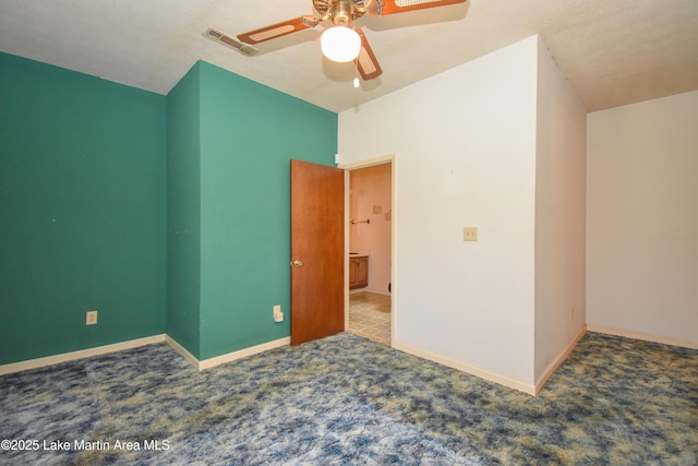 405 4th St, Tallassee, AL 36078 - spare room featuring carpet and a ceiling fan